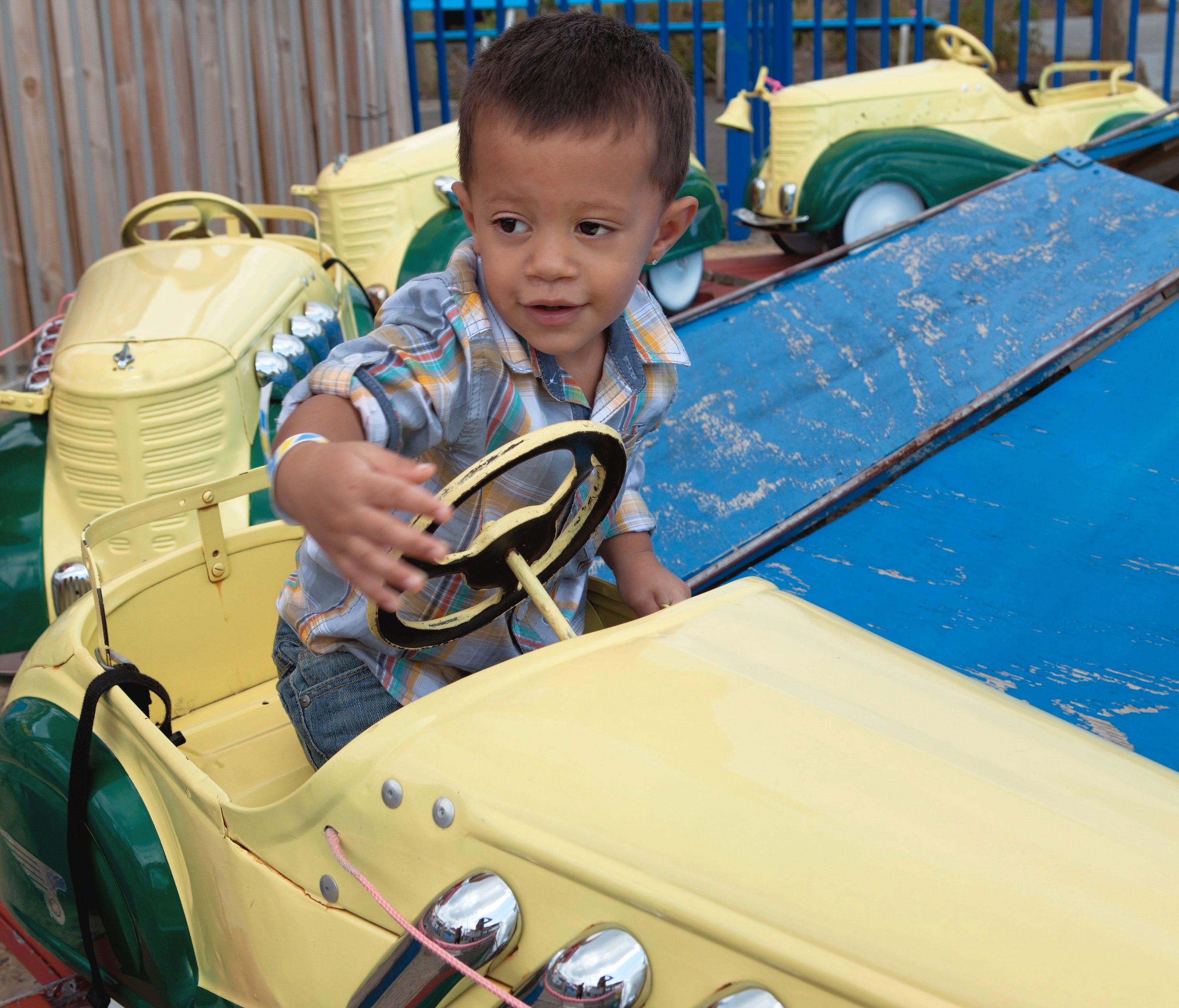 A boy rides the vintage kiddie pedal cars at the Keansburg Amusement Park. The ride turns 80 in the 2017 season.