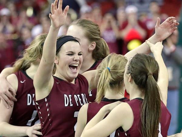 De Pere Annie Schneider cheers as the Redbirds win in overtime against Middleton in a WIAA Division 1 Girls State Basketball semifinal at the Resch Center in Ashwaubenon Friday.