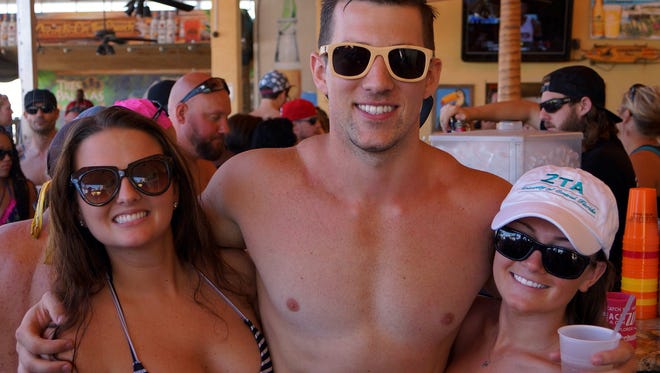 MTV star Tyler Pratt, middle, hangs out during his beach party at Coconuts on the Beach in Cocoa Beach on May 3, 2015.