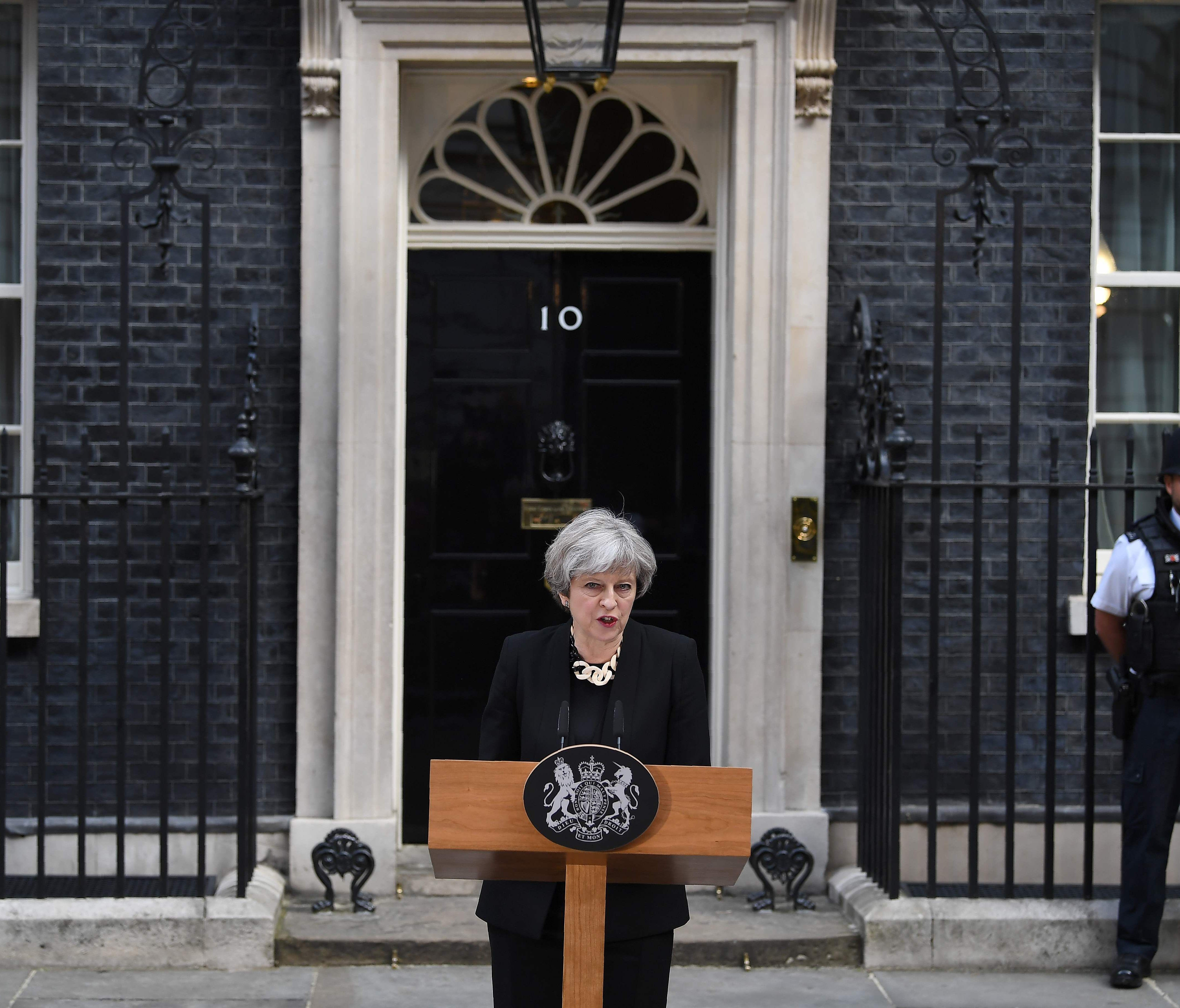 Britain's Prime Minister Theresa May delivers a statement outside 10 Downing Street in central London on June 4, 2017, following the June 3 terror attack. May said tougher Internet regulation was need to prevent terrorist activity online.