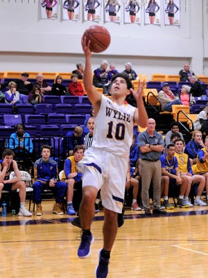 Wylie's Steven Lopez lays the ball in during Thursday's 60-41 win against Wolfforth Frenship.
