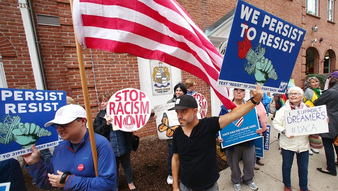 Adam Bell, c, of Verona joined Immigrant rights organizations protesting in front of the Congressional district office of Rodney Frelinghuysen demanding to speak with him as well as legislation that provides a path to citizenship showing in force they will not let DACA go without a fight. September 6, 2017, Morristown, NJ