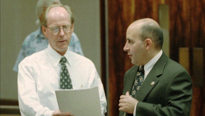 State Deputy Attorney General Rick Eichor, left, looks over papers from plaintiff attorney Evan Wolfson before the start of a same-sex marriage trial in Honolulu in 1996.