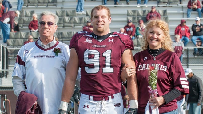 Jason Seaman, center, a Noblesville West Middle School teacher who intervened in a school shooting Friday, formerly played football at Southern Illinois University.