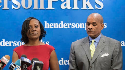 FILE - In this Sept. 22, 2016, file photo, attorney Rhonda Crawford stands alongside her attorney Victor Henderson in Chicago, as she addresses allegations that she impersonated a judge. Crawford, a former law clerk who was fired for impersonating a judge, now is running to become one, and critics say her expected victory is a product of Illinois' system for filling judicial vacancies. (Max Herman/Chicago Sun-Times via AP, File)