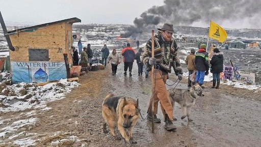 Jasper Spillman, of Lawrence, Kan., leaves the protest camp as opponents of the Dakota Access pipeline leave their main protest camp Wednesday, Feb. 22, 2017, near Cannon Ball, N.D. Most of the pipeline opponents abandoned their protest camp Wednesday ahead of a government deadline to get off the federal land, and authorities moved to arrest some who defied the order in a final show of dissent. (Tom Stromme/The Bismarck Tribune via AP)