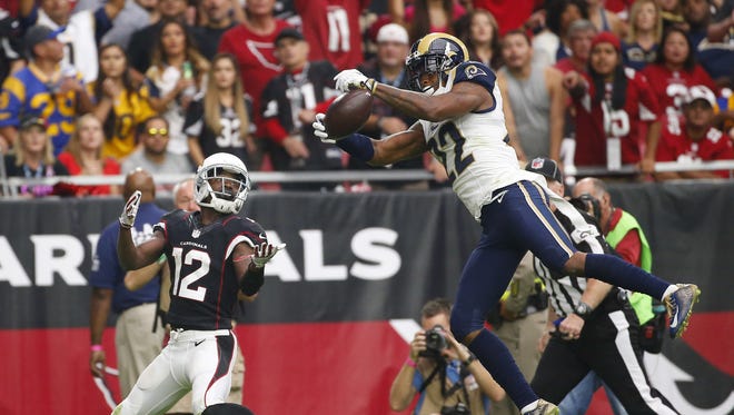 Los Angeles Rams cornerback Trumaine Johnson (22) intercepts a pass intended for Arizona Cardinals wide receiver John Brown (12) during the second quarter at University of Phoenix Stadium October 2, 2016.