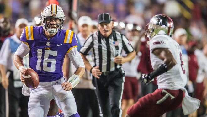 LSU Tigers quarterback Danny Etling (16) gets to the outside with the keeper during a non-conference game against Troy on Saturday Sept. 30, 2017.