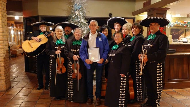Carlsbad Mayor Dale Janway, center, honored members of the local band.