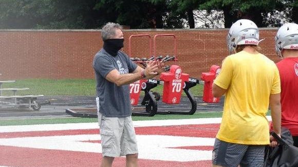 Dover head coach Dan Ifft instructs this players during the first day of practice earlier this month. The Tornadoes kick off the 2020 season tonight against Louisville at Crate Stadium.