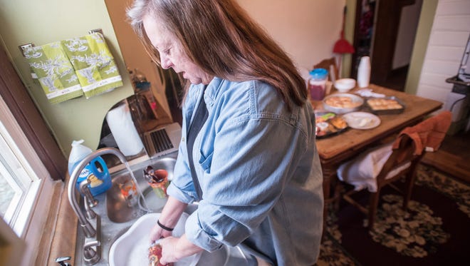 Teresa Frankel finishes the dishes before she goes to a group meeting at Cheryl's House of Hope, where residents must take care of themselves and do daily chores to stay. Frankel came upon the house after she was in a drinking and driving accident involving her grandkids and realized she needed help.  “I have been drinking and doing drugs on and off for 20 years and I wanted to try and learn to be happy instead of not wanting to live,” said Frankel. 