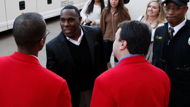 Vanderbilt coach Derek Mason is greeted by Camping World Independence Bowl representatives Roderick Hampton and Trey Giglio Thursday afternoon at Sam's Town Hotel and Casino.