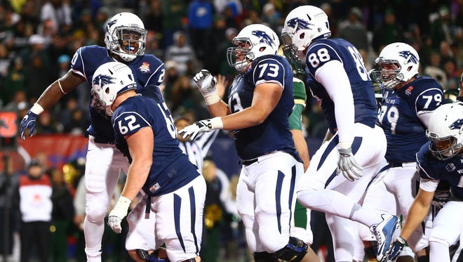 Nevada players celebrate during their 2015 Arizona Bowl win over Colorado State.