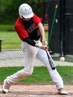 Bryce Pytlarz connects with one of his two hits during Wednesday's 5-4 Division III district championship baseball game against Fairbanks.