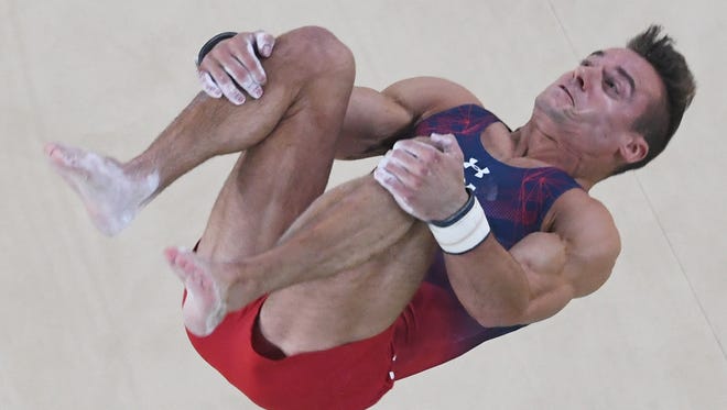 Michigan's Samuel Mikulak had a tough time during his floor exercise Sunday.