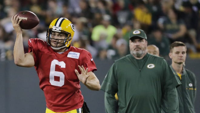 Green Bay Packers quarterback Joe Callahan pump fakes the ball during Family Night at Lambeau Field.