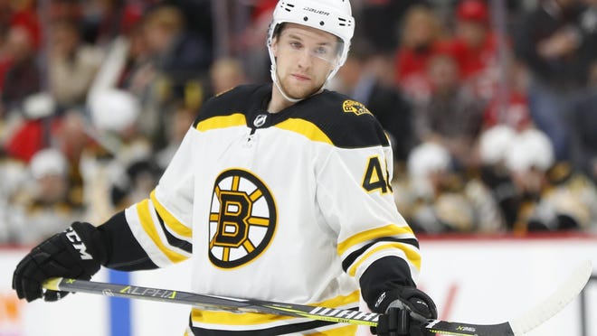 Defenseman Matt Grzelcyk on Saturday signed a four-year contract with a salary cap hit of approximately $3.7 million annually to remain with the Bruins.