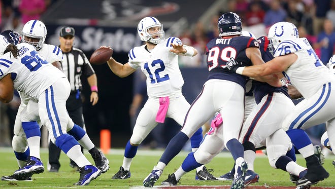 Oct 9, 2014; Houston, TX, USA; Indianapolis Colts quarterback Andrew Luck (12) throws in the pocket against the Houston Texans at NRG Stadium.