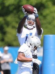 Lions receiver Andy Jones goes through drills during