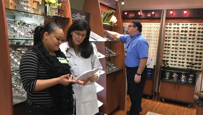 Atlanta-based Emory Eye Center is one of 32 new clients managed by Vision Associates in Warren. 
Pictured left to right are optician Tia Atkinson, optometrist Fulya Anderson, and licensed dispensing optician Chris Rosenbluth.