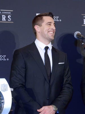 Jan 31, 2015; Phoenix, AZ, USA; Green Bay Packers quarterback Aaron Rodgers (left) and Pittsburgh Steelers running back Le'Veon Bell pose with the FedEx Air & Ground Player of the Year trophy at the 4th annual NFL Honors at Symphony Hall. Mandatory Credit: Kirby Lee-USA TODAY Sports