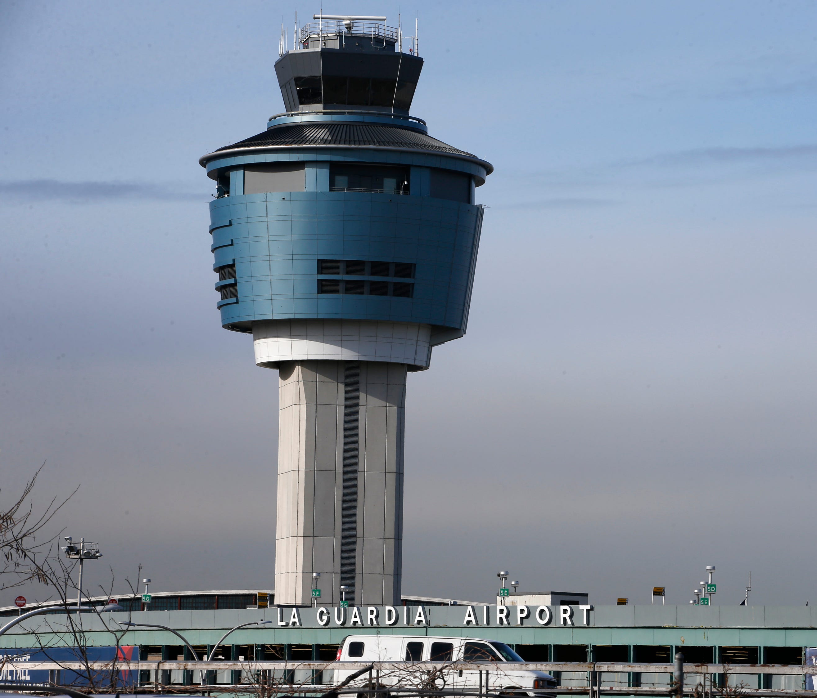 File photo: An air traffic control tower rises above a ramp serving LaGuardia Airport in New York on Jan. 21, 2015.