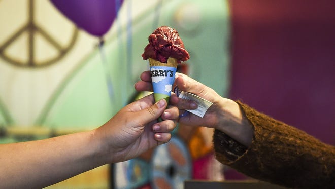 People wait in line for a free cone from Ben & Jerry's in 2015, in Fort Collins.