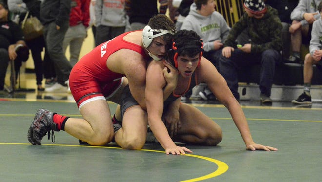 Delsea's Vince DeGeorge (top) maintains control of
Middletown North's Tom Anderson during the 182-pound final at the Mustang Classic on Wednesday.
