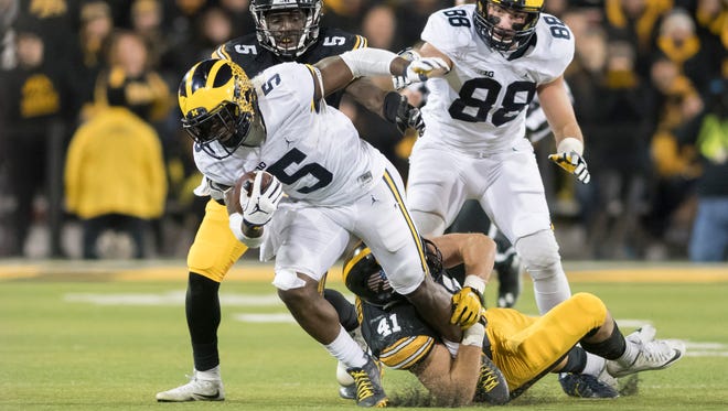 Michigan safety Jabrill Peppers is tackled by Iowa linebacker Bo Bower in the third quarter.