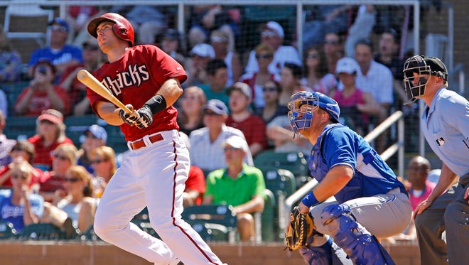 Arizona Diamondbacks' Paul Goldschmidt  watches his two-run home run in the fourth inning against the Kansas City Royals in their spring training game Saturday, March 28, 2015 at Salt River Fields at Talking Stick, Ariz.