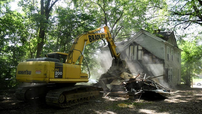 In this 2017 file photo, an excavator is used to demolish the vacant house located at 133 W. Deaderick Street in Downtown Jackson, Wednesday, July 12. The building was the first to be demolished in Jackson under Tennessee's Blight Elimination Program. A total of 95 houses were demolished over four years.