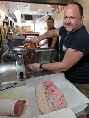 Nick Evangelista owns Vintage Subs in Asbury Park. He is pictured in the sandwich shop's original location on Cookman Avenue.