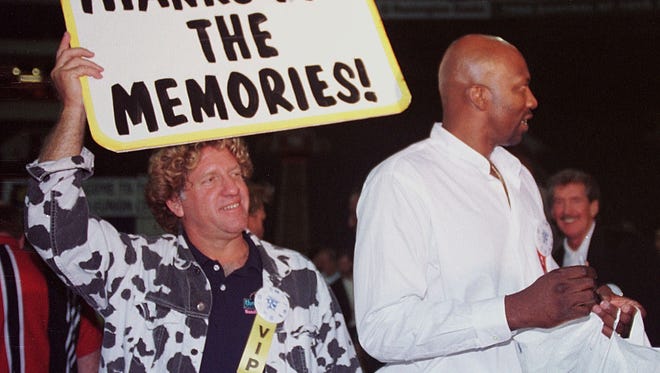 A 1997 ABA reunion at the Hoosier Dome, Matt Asen ( left, from Sanibel Island, FL) had a sign for everything tonight, including a simple thank you. Former ABA player Marvin Barnes (right) was one of the celebrities present tonight.