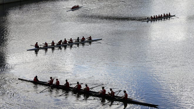A rowing team practices along the Scioto River in Columbus on Saturday, September 30, 2017.
