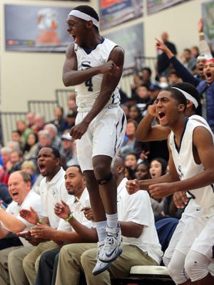 Sierra Canyon's Devearl Ramsey (4) leaps into the air while reacting to a teammate's dunk. Ramsey is committed to play basketball at the University of Nevada.