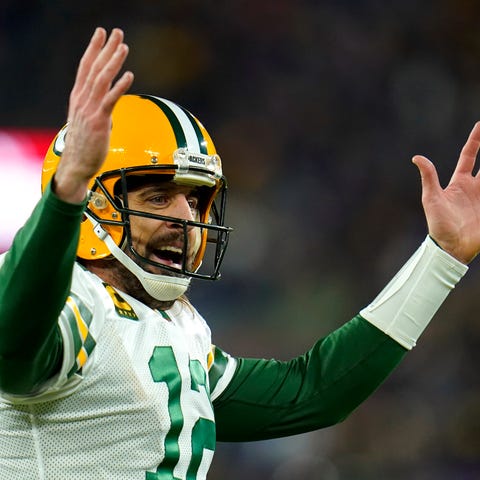 Green Bay Packers quarterback Aaron Rodgers celebr