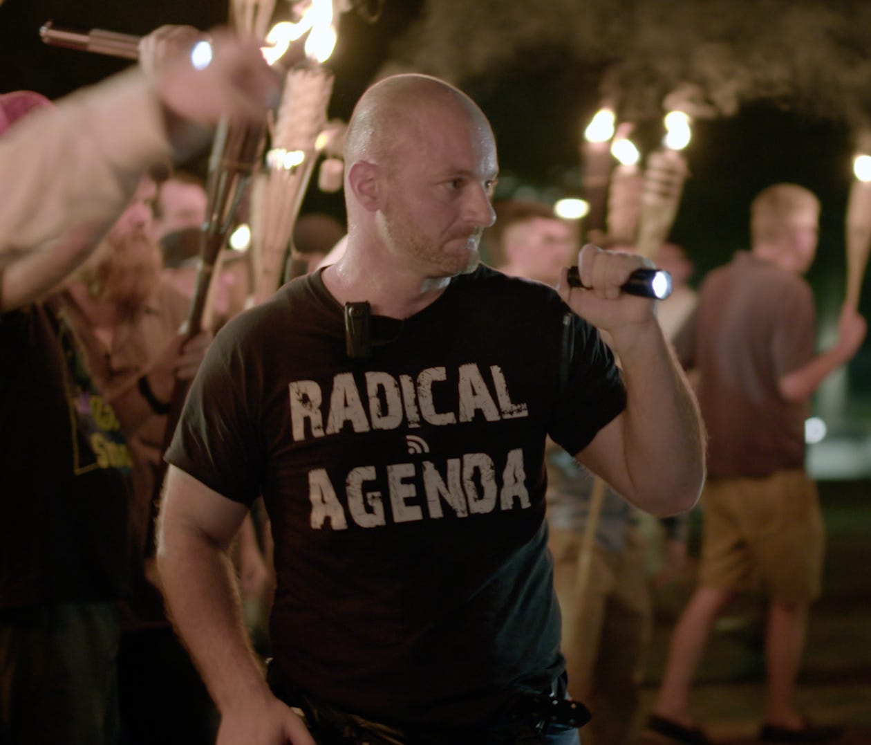 In this Friday, Aug. 11, 2017, image made from a video provided by Vice News Tonight, Christopher Cantwell attends a white nationalist rally in Charlottesville, Va.