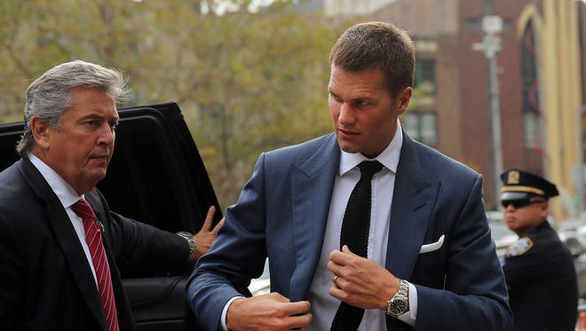 Tom Brady (R) of the New Englang Patriots arrives at federal court to contest his four game suspension on Aug. 31, 2015 in New York City.
