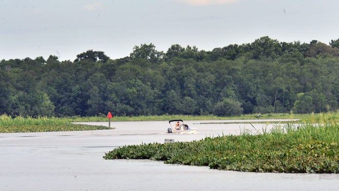 Boaters cruise the Nanticoke River near Phillips Landing Tuesday. The land is being purchased as part of a preservation effort.