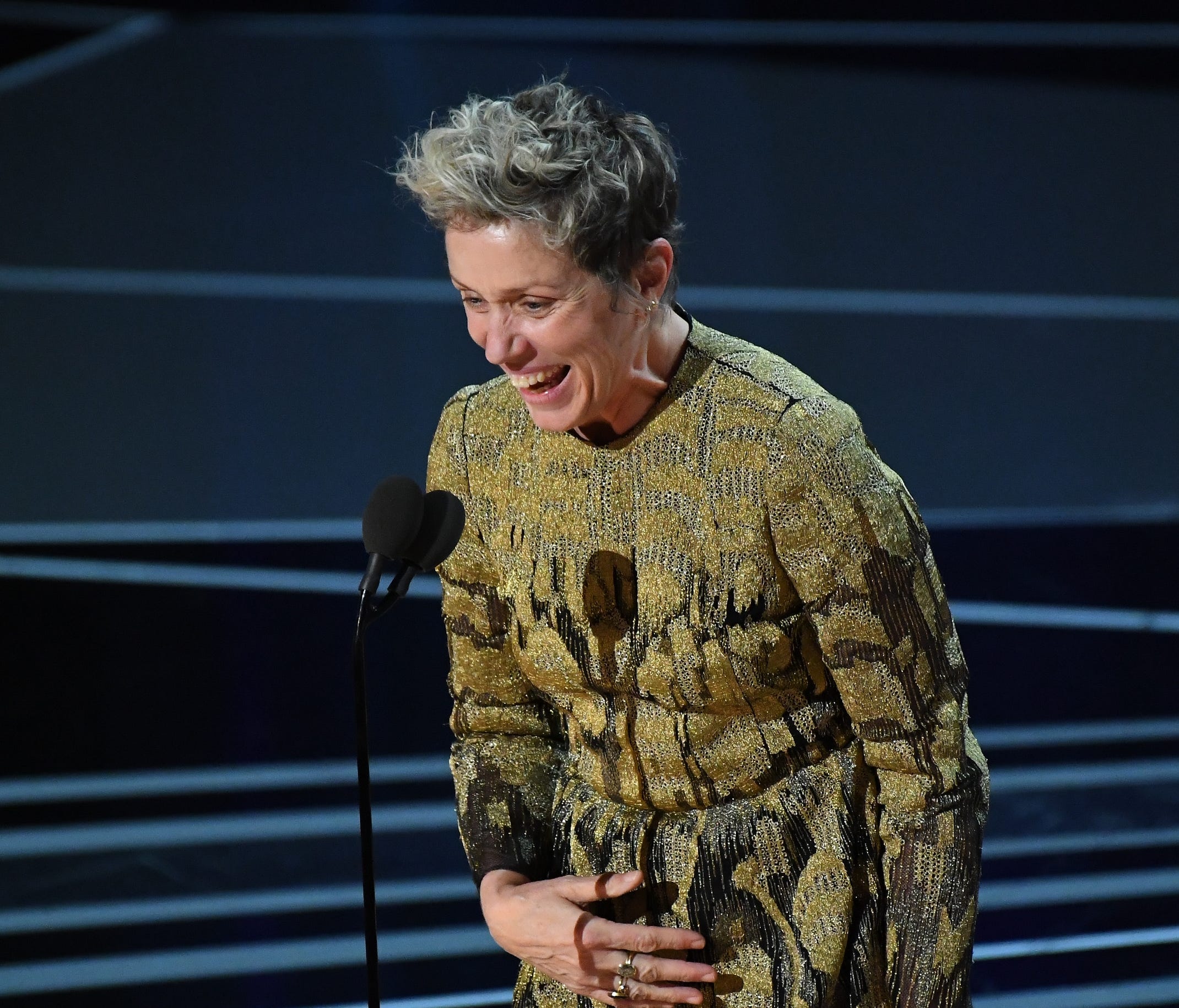 Frances McDormand accepts the Oscar.