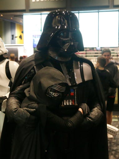 Porter Sessions dressed as Kylo Ren hugs Darth Vader,