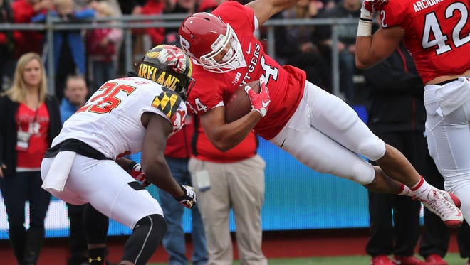 Rutgers running back Paul James (34) dives for yardage as Maryland defensive back Darnell Savage Jr. (26) looks to make a tackle during the first half of an NCAA college football game Saturday, Nov. 28, 2015, in Piscataway, N.J. (AP Photo/Mel Evans)