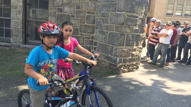 Jovanny Leon, 6, and his sister Montzerrat, 8, each got new bicycles Saturday at the annual Bicycle Give Away in New Rochelle.