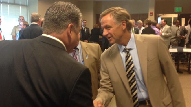 Gov. Bill Haslam made his way around the room inside the Jackson Chamber of Commerce before he spoke about the state’s lacking highway fund.