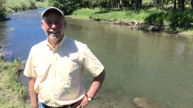 GOP gubernatorial candidate Greg Gianforte stands by the East Gallatin River that runs by his home.