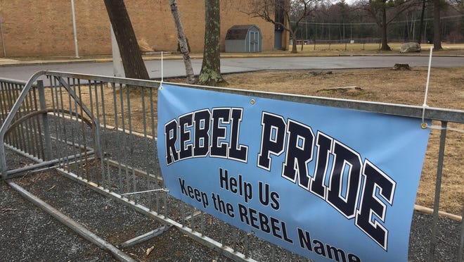 A sign outside of polls in South Burlington advocates for the “Rebel” moniker, which the South Burlington School Board voted to shed.