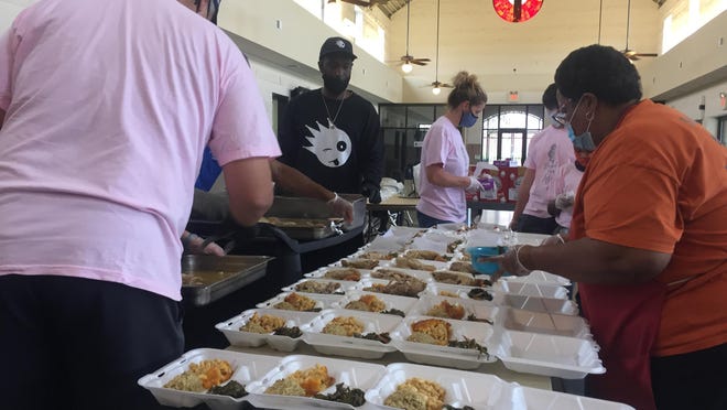 Volunteers at the Master's Table Soup Kitchen prepare 300 boxed Thanksgiving meals for guests in need Thursday, Nov. 26, 2020.