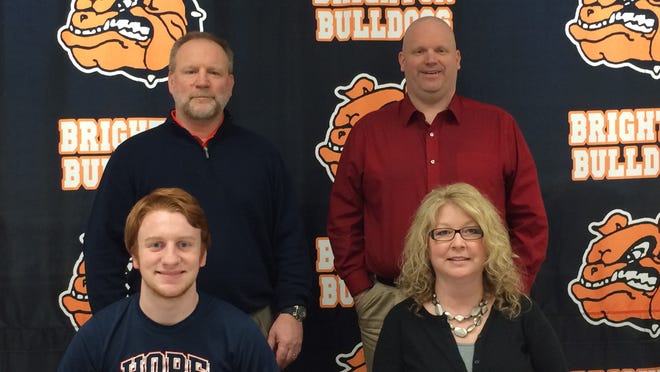 Tyler Trisch, lower left, recently signed to play football at Hope College next season. With him are (seated) his mother, Lisa, and (back row), his father, Todd and former Brighton coach Cliff Kiefer.