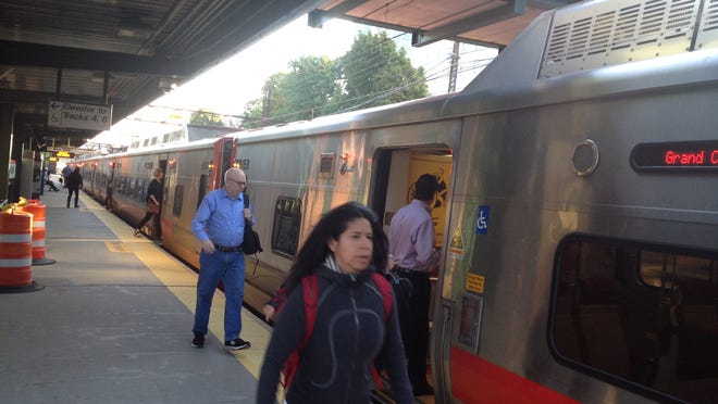 Passengers board a Manhattan-bound Metro-North train at New Rochelle on Friday morning.
