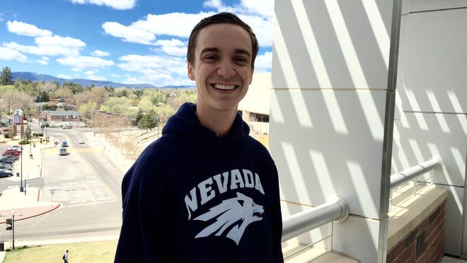 The new student body president of the University of Nevada, Reno Caden Fabbi stands on a balcony at The Joe Student Union.